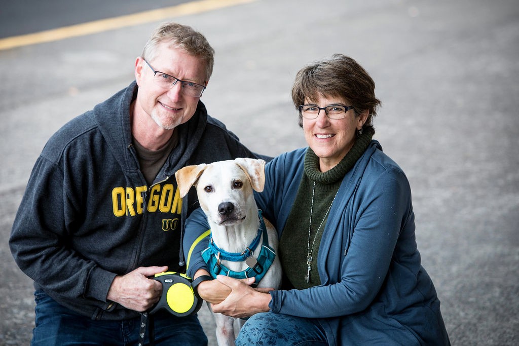 Two Training Spot clients together with their dog